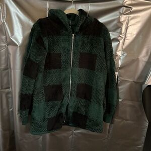 New in bag. Fleece green and black jacket